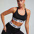 Biustonosz sportowy HKMX The Crop Logo Level 1, Czarny